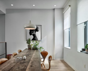 Lutron motorized roller shades in Kelowna living room — matched fabrics