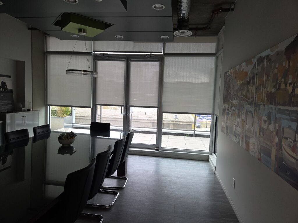 Commercial boardroom roller shades installed by Pfitztech