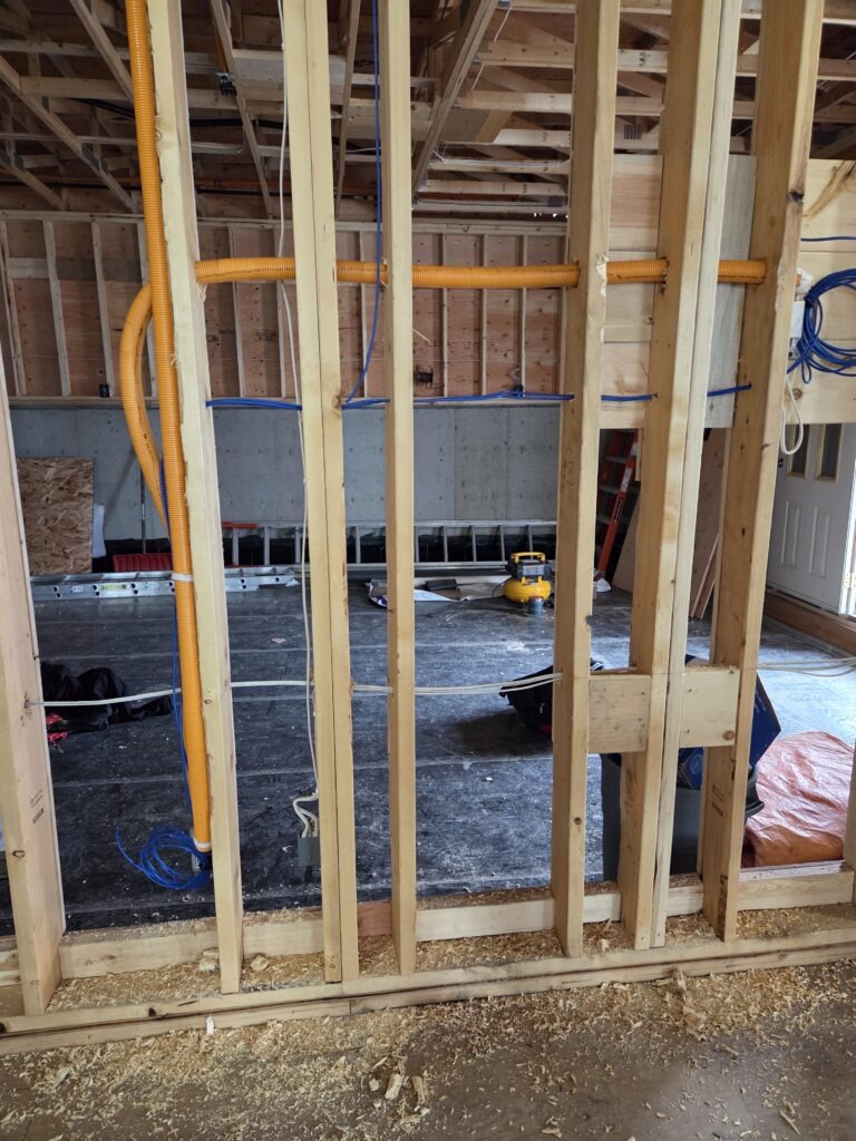 Electrical conduit run through new-build framing